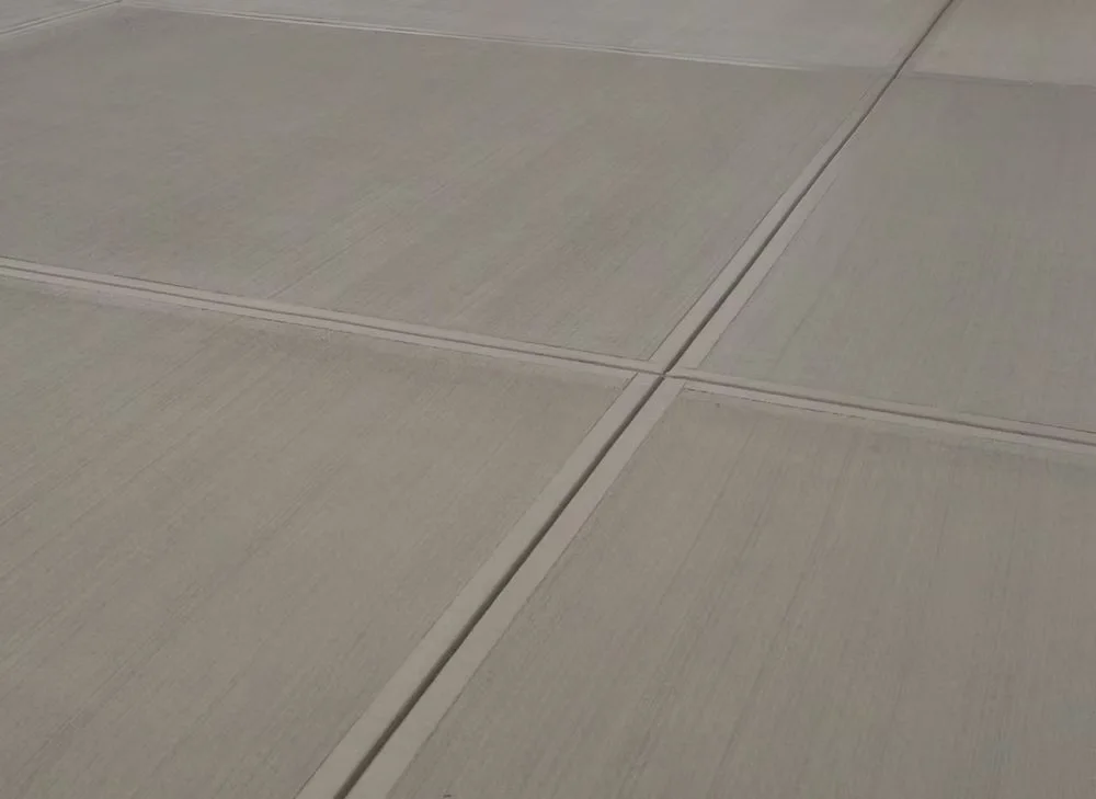 Close-up of a smooth garage floor with control joints