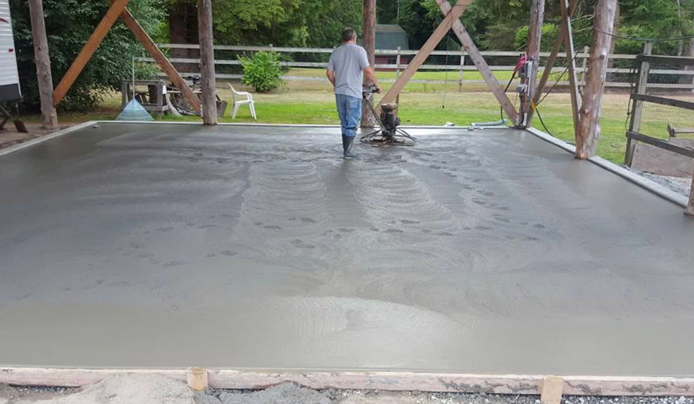 Power trowel finishing a large covered concrete slab